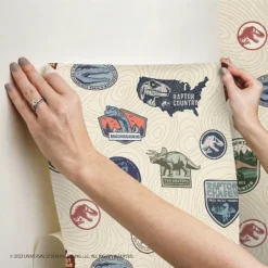 Jurassic World Badges Peel & Stick Wallpaper Beige - RoomMates -Child Home Decoration Store GUEST e405b9a5 b58f 40e0 b7d9 727072ebf4cc